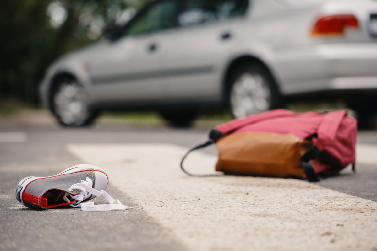 bag and shoe outside a car on ground from a person n need of a car accident lawyer