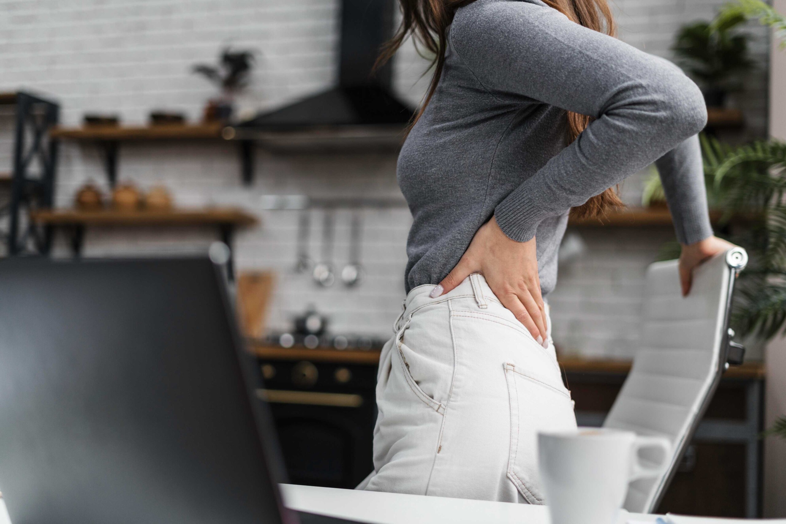 side-view-woman-having-backache-while-working-from-home Body Back Buddy Injury